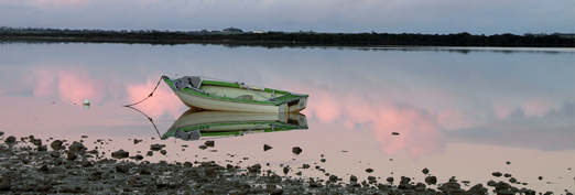 boat on beach sunset
